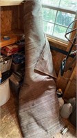 Large Rolled Up High Pile Rug Stored in Shed