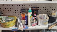 Shelf of tape, oil, & misc