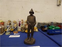 BRONZE TONED CERAMIC SCULPTURE OF A FIREFIGHTER