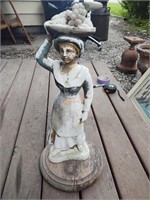 Plaster woman carrying fruit figure on wooden base