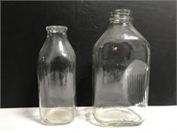 Two old glass milk bottles