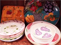 11 pieces of decorated pottery dinnerware