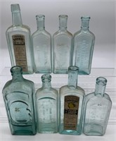 8 blue glass bottles, 2 w/paper labels