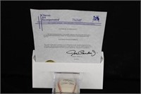 Pete Rose signed ball in case