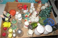 Collection of various salt and pepper shakers.