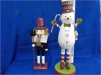 2 Holiday nutcrackers Snowman nose clipped