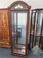 Lighted curio cabinet. Solid glass front. 2 g