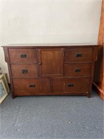 Dresser with 6 drawers and a center cabinet.