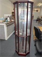 Lighted glass front curio cabinet with 4 glass