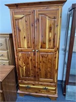 Cedar armoire. Top has hanging cloths bar and 2