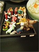 Container of miniatures including people and