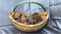 Footed basket with pine cones