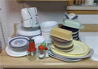 Large assortment of plates, bowls, salt and
