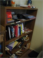 Bookcase with misc books, office supplies