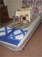 Twin bed, frame mattress with linens