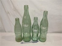 4 Coca Cola Bottles