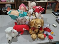 BASKET FULL OF BABIES AND STUFFED ANIMALS