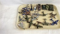 Collection of toy tanks, airplanes, and