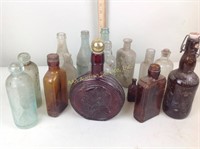 Old glass bottles including old remedy bottle,
