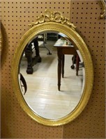 Bow Crowned Gilt Framed Beveled Mirror.