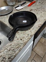 2 cast iron skillets, 9" & 10". Smaller one needs