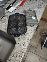 Cornbread pans, 1 is cast iron, 1 is aluminum.