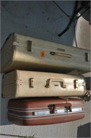 3 old suitcases