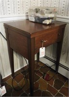 Kenmore sewing machine in cabinet with sewing