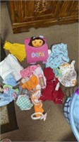 BASKET OF DOLL CLOTHES AND BAGS