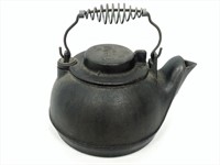 Vintage cast-iron Wagner tea kettle.