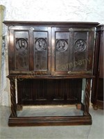 Early French Hunt Cabinet.Carved Faces
