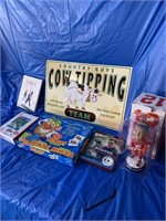 Calf tipping sign, yoga CD, memory game,  Bourne