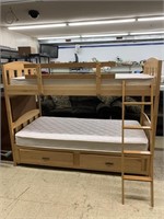 Set of bunk beds with ladder to top bunk.