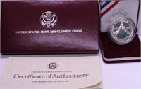 PROOF OLYMOPIC SILVER DOLLAR W BOX PAPERS