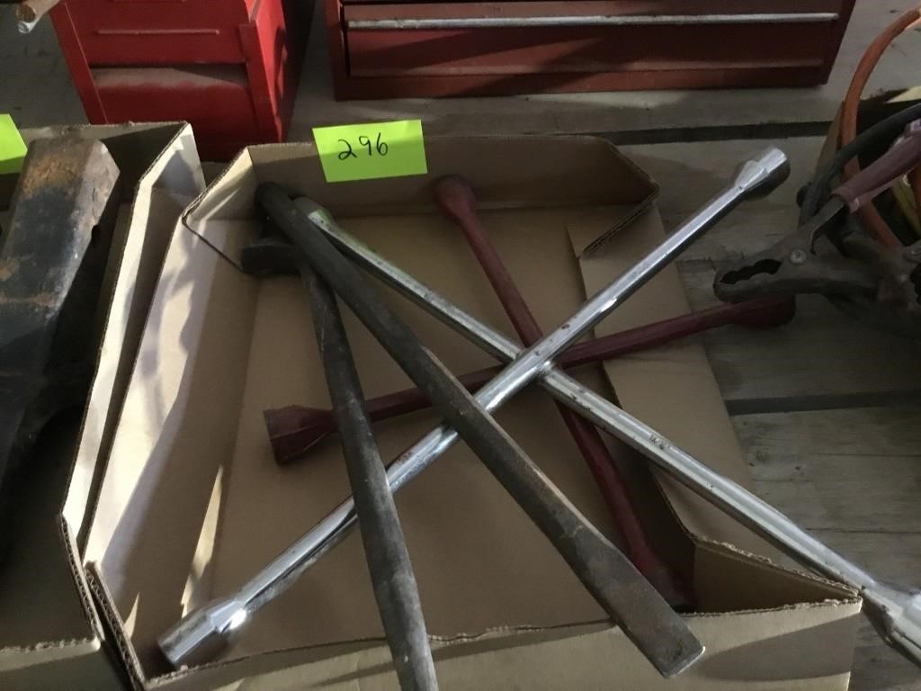 Box of 4 way wrenches, pry bars.