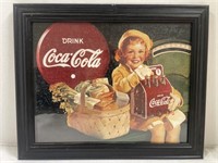 Framed art from a Coca-Cola calendar. 15.5” x