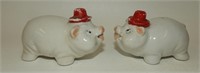 Anthropomorphic White Pigs in Red Top Hats