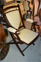 Vintage folding wooden sedan style chair,