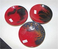 Three Royal Doulton flambe veined small plates