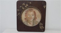 Framed round pastel drawing of a woman