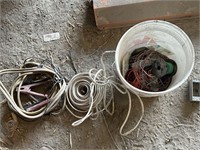 bucket of electrical and jumper cables