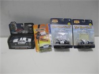 NIP Four Assorted Collectible Die Cast Cars