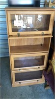 Bookcase cabinet measuring approximately 60 1/2