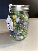 JAR OF VINTAGE MARBLES 5.25 in