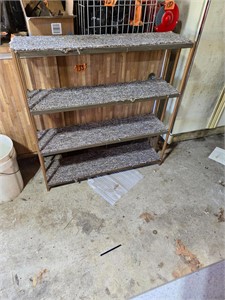 Metal shelving unit with carpet
