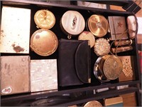 Container of vintage compacts: coin purses,