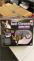 Self cleaning litter box cat