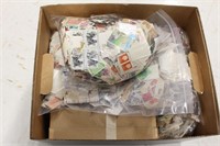 10,000+ Worldwide Stamps off paper in bankers box,