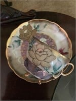 Antique raised handpainted cup, and saucer