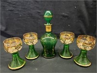 Green decanter & glasses/ 1 glass is broken